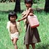 Juliana and her sister fetch water, 1991