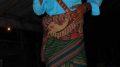 Getting dressed with sword for a traditional ceremony in Sumba, Indonesia