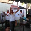 An election official holds up a ballot to be counted - Aceh elections