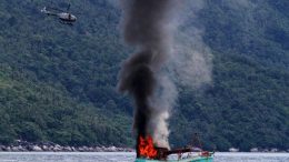 Indonesian forces sink a Vietnamese fishing boat, December 2014.