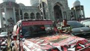 A proto-military jeep in front of a mosque at a Partai Aceh rally in Aceh, Indonesia